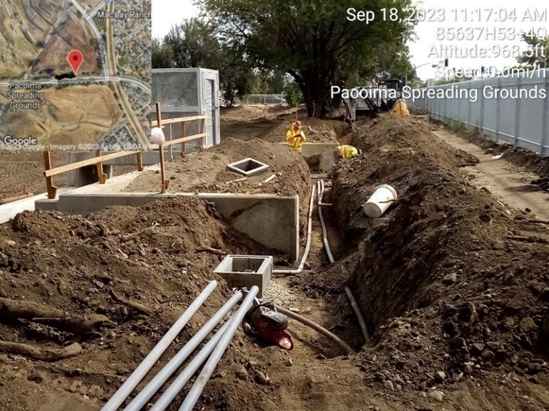 Installing power conduits and pull boxes for East Settling Basin Overflow Structure